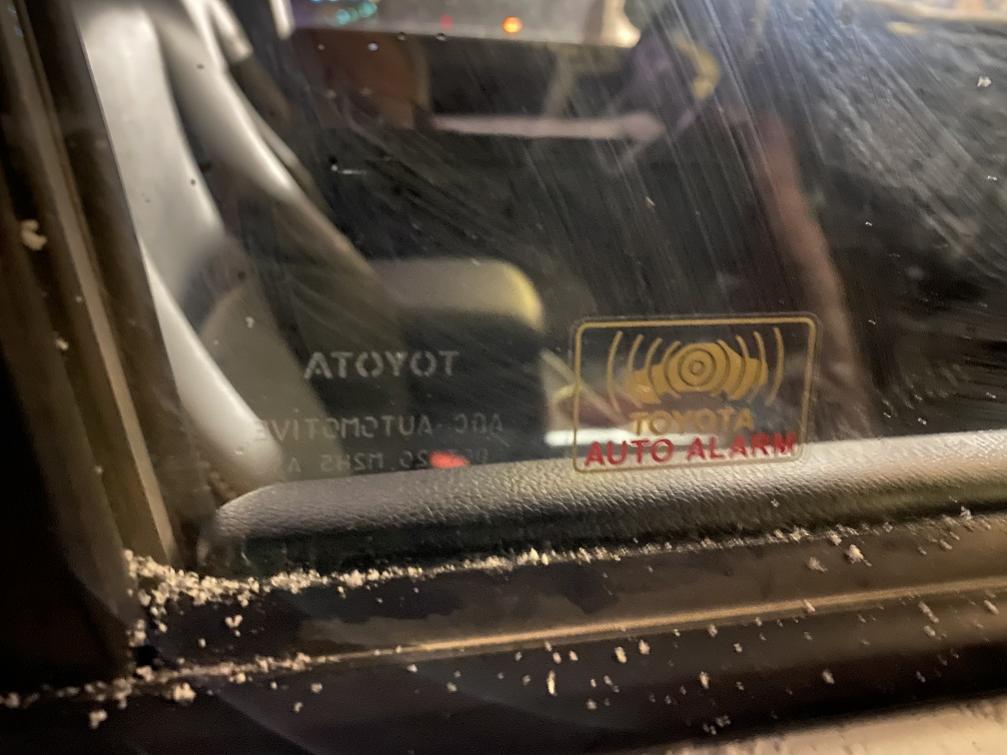 Standing outside the vehicle, is the Toyota logo backwards on passenger side glass?-img_1588[1]-jpg